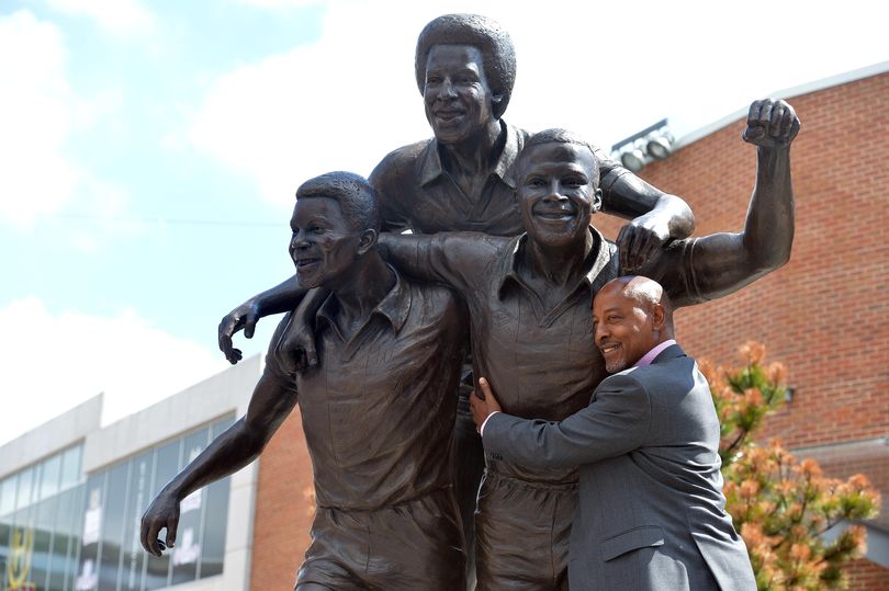 Retired footballer, Brendon Batson pictured with the Three Degrees statue dedicated to West Bromwich Albion players, Brendon Batson, Laurie Cunningham and Cyrille Regis (Image: BIRMINGHAM MAIL / BPM MEDIA)