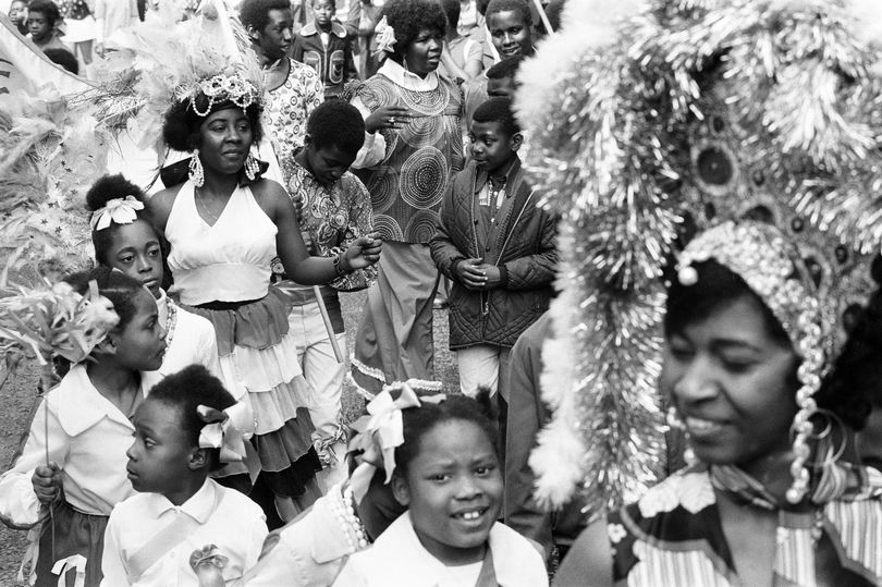 Black and white image of carnival goers